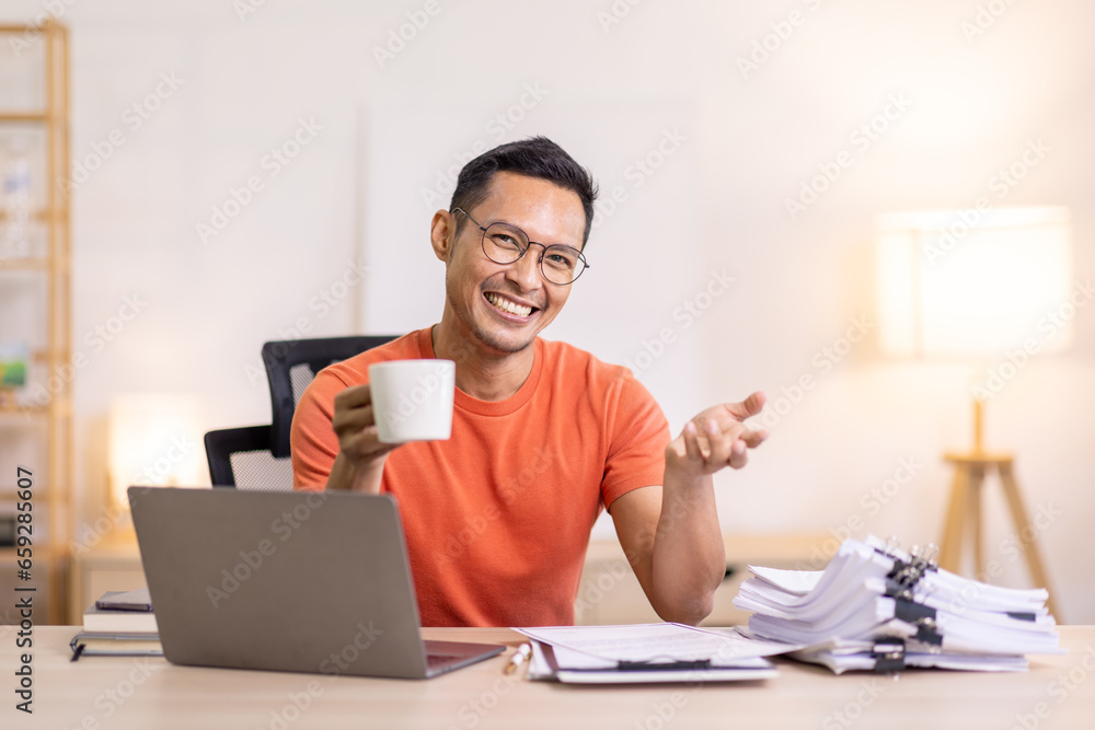 Happy business man work on laptop for email update, online project and reading digital report with mockup space. freelance asian man entrepreneur and working from home research, planning and info Happy business man work on laptop for email update, online project and reading digital report with mockup space. freelance asian man entrepreneur and working from home research, planning and info