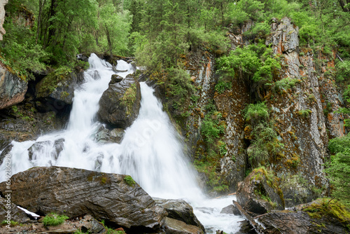 Waterfall in the forest. Russia  Siberia  Altai mountains.