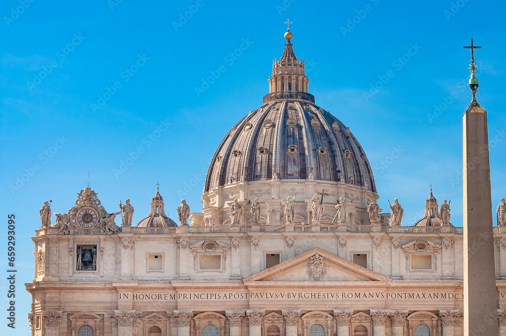 Fragment of Basilica of St. Peter in the Vatican and column on Saint Peters square in Vatican