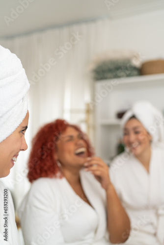 Staff and costumers of a beauty salon laughing and chatting