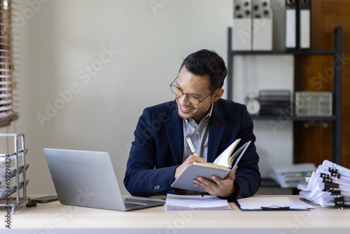 Business Documents, Auditor businessman checking searching document legal prepare paperwork or report for analysis TAX time,accountant Documents data contract partner deal in workplace office photo