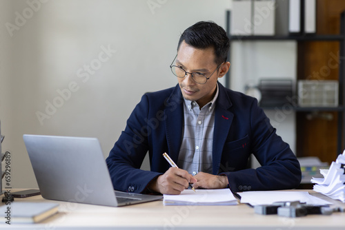 Business Documents, Auditor businessman checking searching document legal prepare paperwork or report for analysis TAX time,accountant Documents data contract partner deal in workplace office