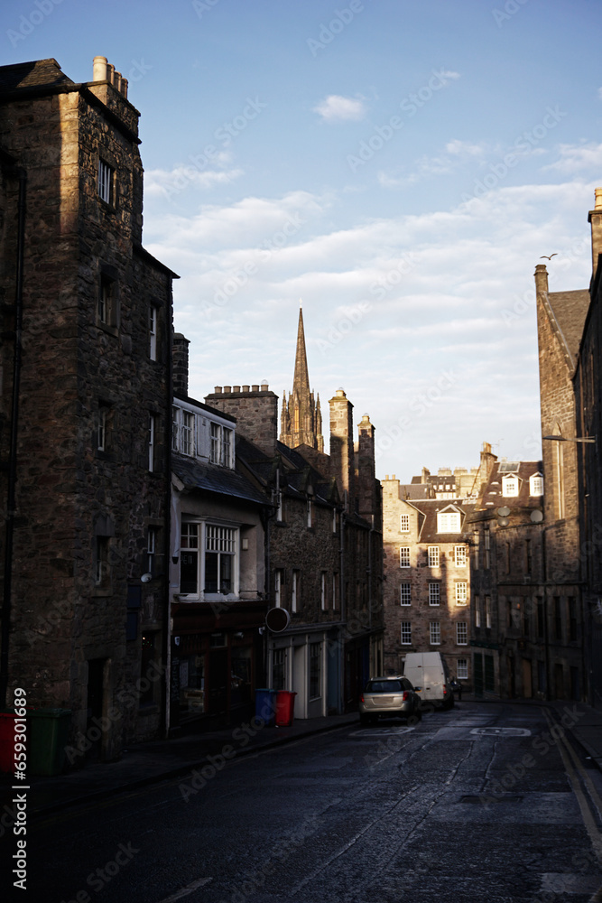 Exterior landscape of European architecture and building decoration of  'Candlemaker row street' with cloudy blue sky located in Scottish old town- Scotland, United Kingdom