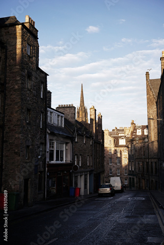 Exterior landscape of European architecture and building decoration of 'Candlemaker row street' with cloudy blue sky located in Scottish old town- Scotland, United Kingdom