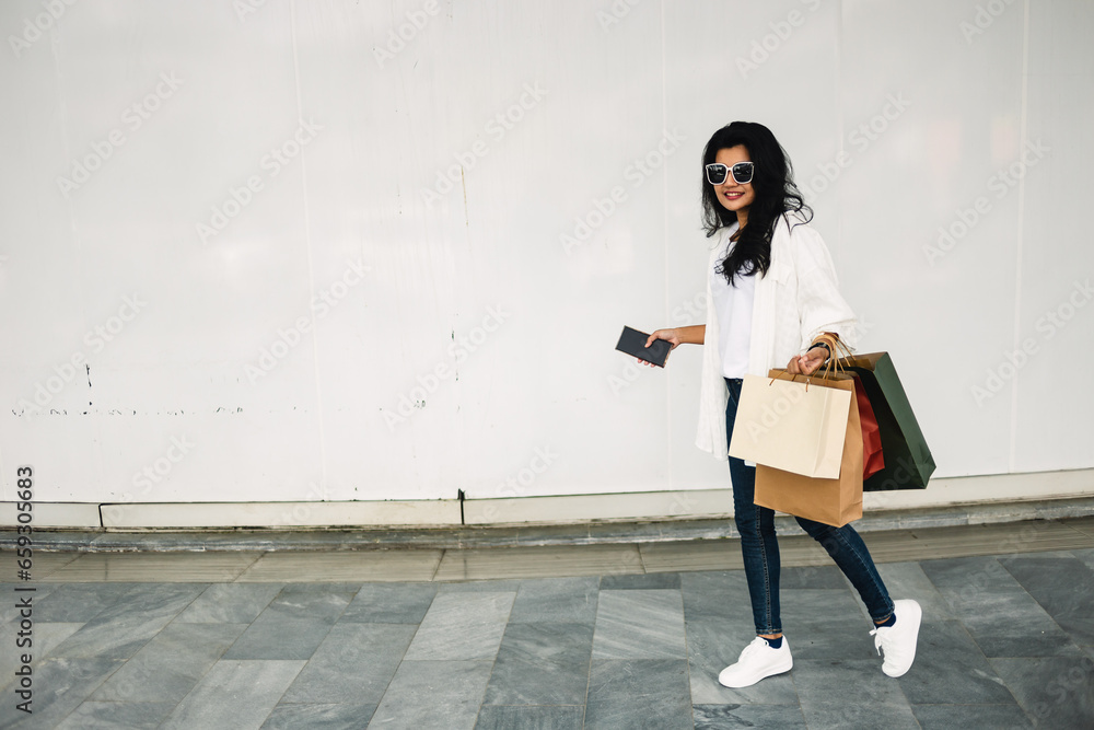 Beautiful asian woman with shopping bags in the shopping mall. Beautiful asian woman with shopping bags in the shopping mall.