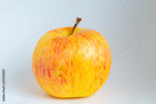 Red and yellow apple on a white background