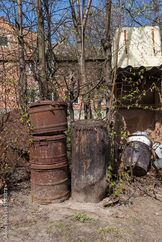 Old rusty containers in a yard