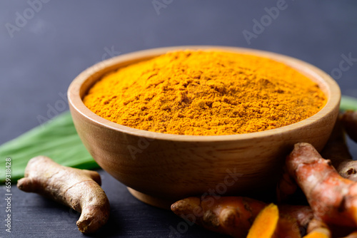 Turmeric powder and fresh turmeric (Curcuma, curcumin), Food ingredient in Asian cuisine