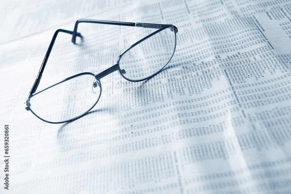 Close up of eye glasses on a business document. Close up of eye glasses on a business document.