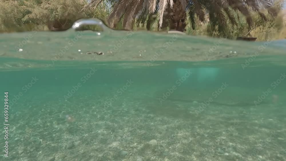 Underwater video of the crystal clear blue water at Einot Tzukim fountain in the Dead Sea, Israel. Underwater video of the crystal clear blue water at Einot Tzukim fountain in the Dead Sea, Israel.