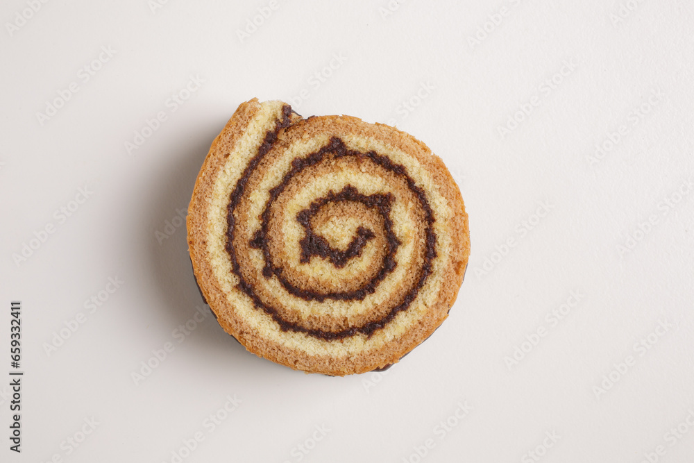 Fototapeta premium brioche swirl with chocolate on a white background shot from above