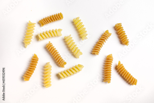 pasta of various kinds on a white background, top view
