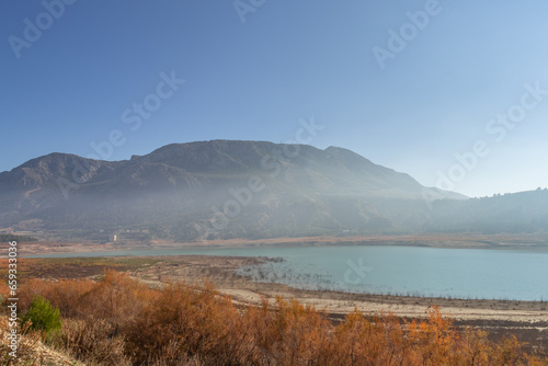 Foggy haze above the Negratin lake in Andalusia, Spain, on a sunny winter day