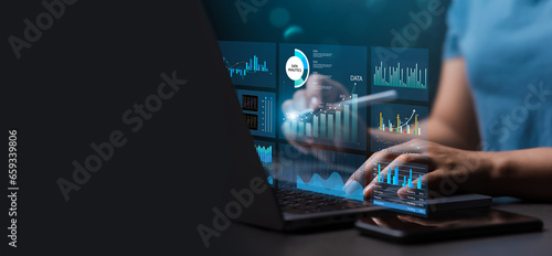 Female analyst uses Work on laptop and dashboard for business analysis, data and data management system with KPIs and indicators connected to database for technology finance. Corporate strategy photo