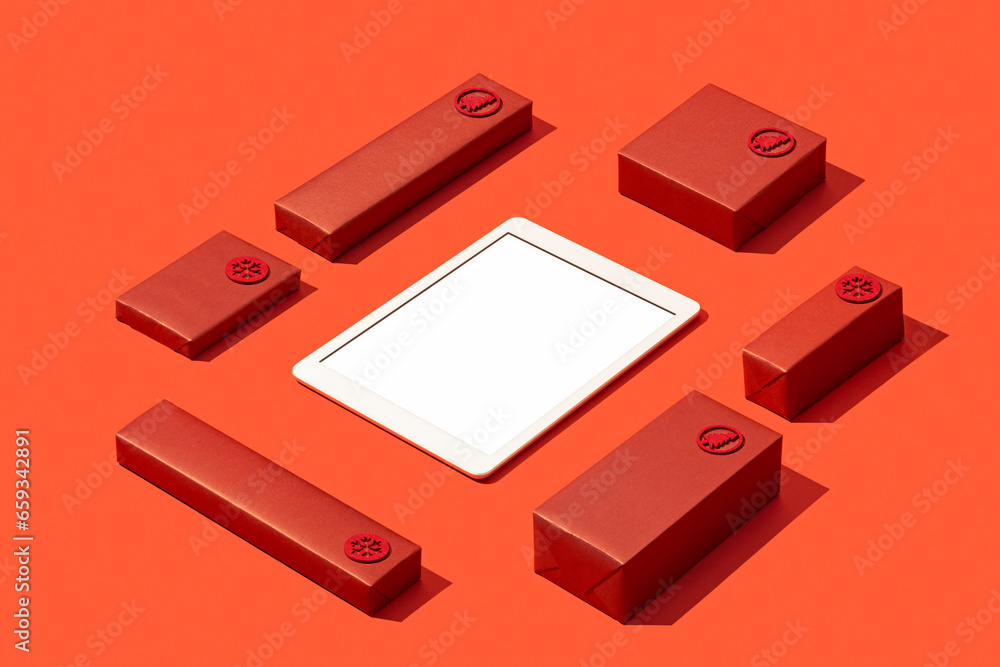 Digital tablet mockup, template with red gift box son red background Digital tablet mockup, template with red gift box son red background