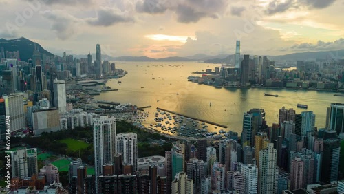 Aerial hyperlapse, dronelapse video of Hong Kong city at sunset photo