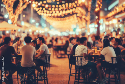 Bokeh background Street Bar beer restaurant, outdoor in asia, People sit chill out and hang out dinner and listen to music together in Avenue, Happy life ,work hard play hard