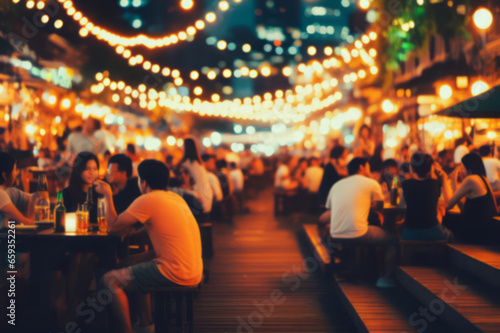 Bokeh background Street Bar beer restaurant  outdoor in asia  People sit chill out and hang out dinner and listen to music together in Avenue  Happy life  work hard play hard