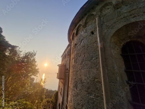 medieval church of San Nicolò Capodimonte san rocco of camogli at sunset photo