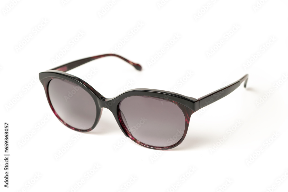 Black elegant female Sunglasses with purple details isolated on white background. Sun glasses summer accessories as design element. Clipping path included