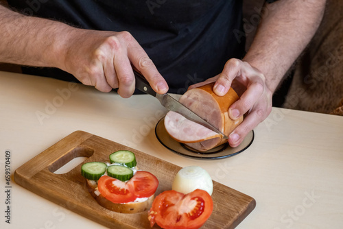 Hands man preparing sandwic...
