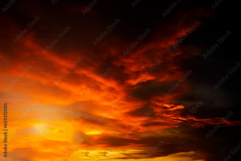 Beautiful deep orange sky with clouds after sunset. Sunset sky nature background, can be used as a background.