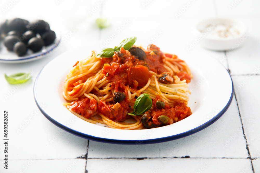 Traditional pasta with tomatoes, olives and anchovy Traditional pasta with tomatoes, olives and anchovy