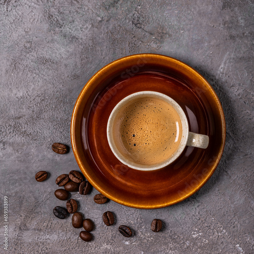 espresso coffee in cup, top view on gray textured background