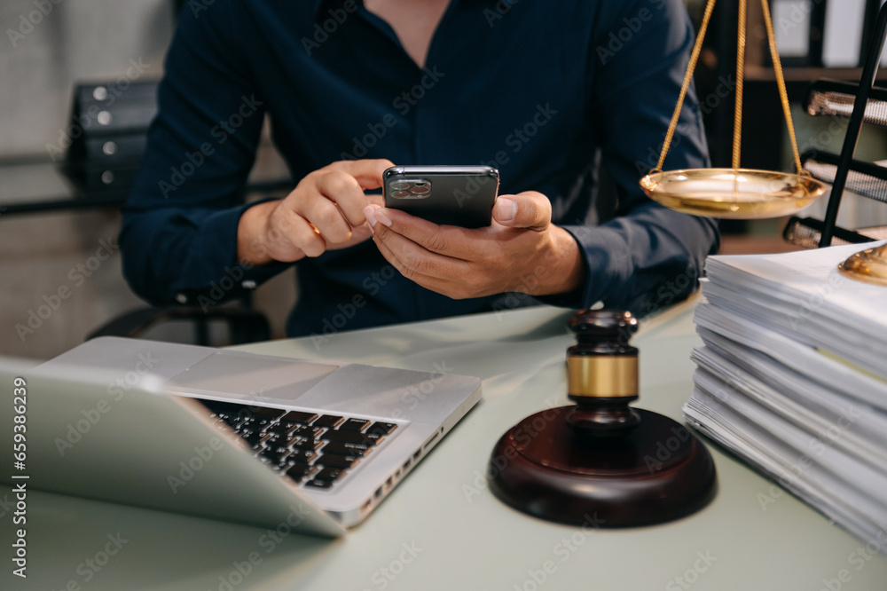 justice and law concept. asian woman lawyer working and judge in a courtroom the gavel, working with tablet and laptop and digital tablet computer justice and law concept. asian woman lawyer working and judge in a courtroom the gavel, working with tablet and laptop and digital tablet computer