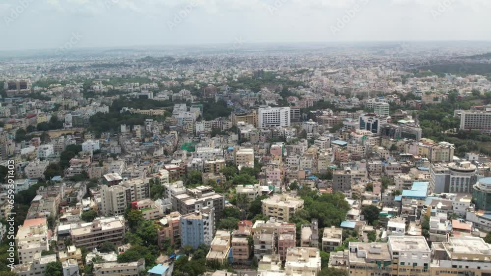 Afternoon 4K Aerial video of Hill top colony, Banjara Hills and Khairtabad is an urban residential and commercial centre in Hyderabad, Telangana, India. shows Houses terrace and trees. Afternoon 4K Aerial video of Hill top colony, Banjara Hills and Khairtabad is an urban residential and commercial centre in Hyderabad, Telangana, India. shows Houses terrace and trees.