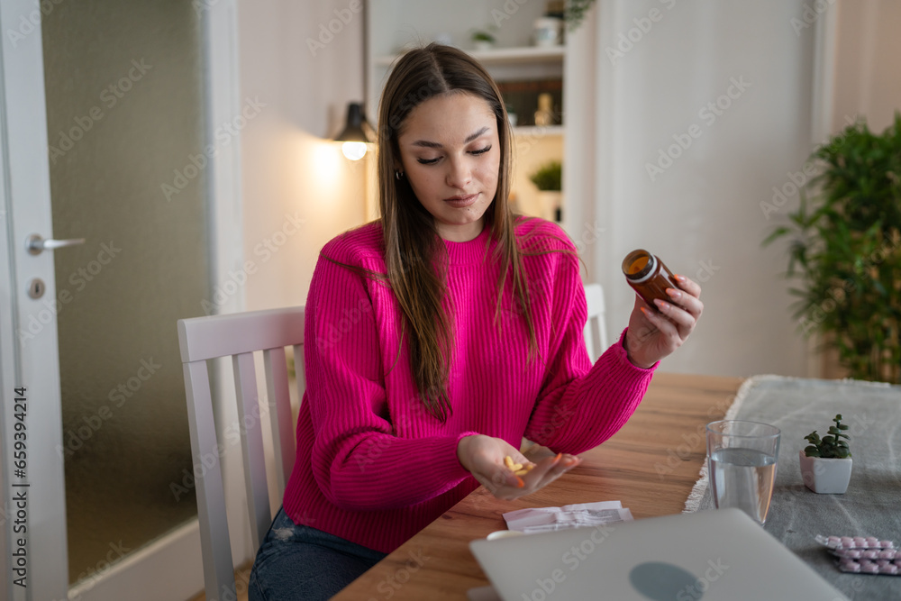 one woman young caucasian female take drugs medicine vitamin at home one woman young caucasian female take drugs medicine vitamin at home