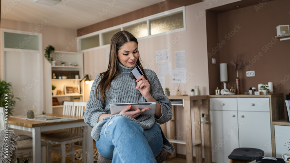 happy woman online shopping use credit card use digital tablet at home happy woman online shopping use credit card use digital tablet at home