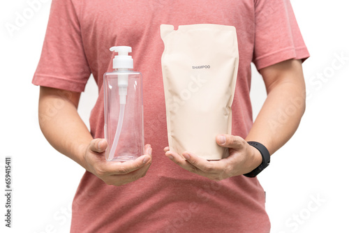 Slika na platnu Man choosing shampoo plastic packaging for refill pouch isolated on white background