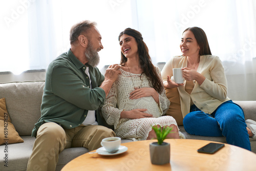 father paid visit to his pregnant daughter and her partner, in vitro fertilization concept