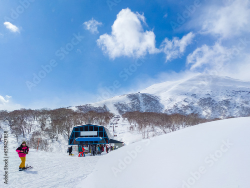 View of the ski resort summit over a chairlift station (Niseko, Hokkaido, Japan)