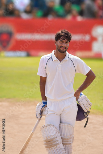 Portrait of a Cricket player standing with bat