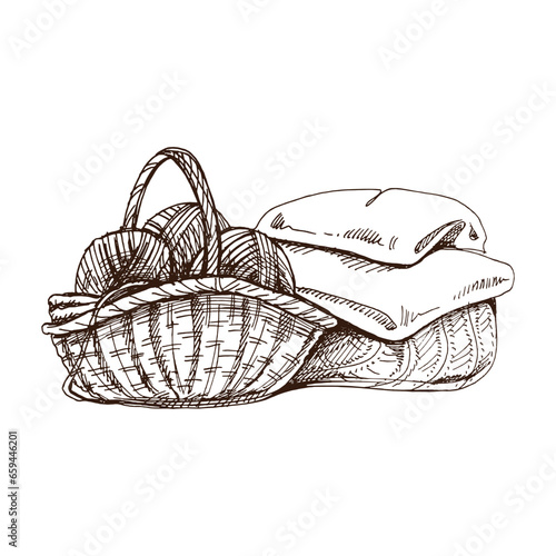 Hand-drawn sketch of basket with balls of yarn, wool, knitted goods. Knitwear, handmade, knitting equipment concept in vintage doodle style. Engraving style.