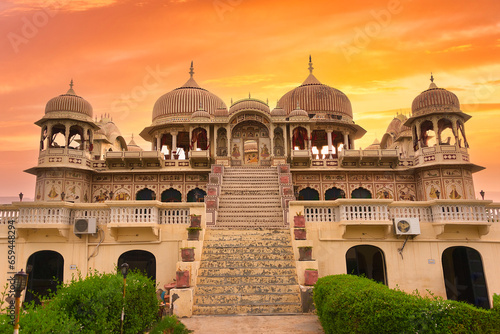 Traditional north Indian building in Mandawa on the Mandawa Rod with four classic style haveli domes at sunset. Frescoed Haveli in Mandawa, traditional ornately decorated building. Mandawa, Rajasthan