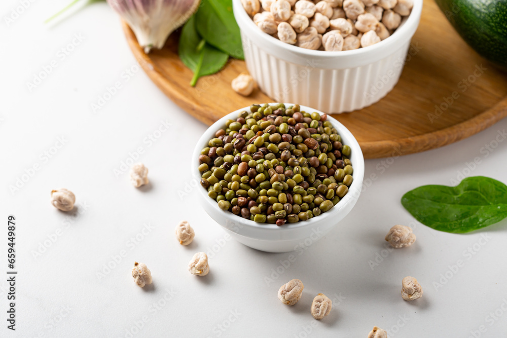 Close up of uncooked green mung beans chick pea spinach food top view Close up of uncooked green mung beans chick pea spinach food top view