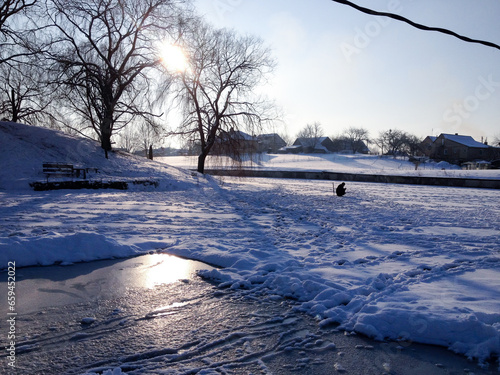 Winter fishing under the sun