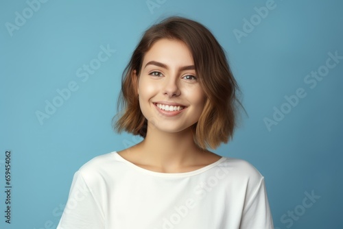 Portrait of a joyful lady model wearing casual blank clothes and smiling. Isolated on a plain colored background. Generative AI.