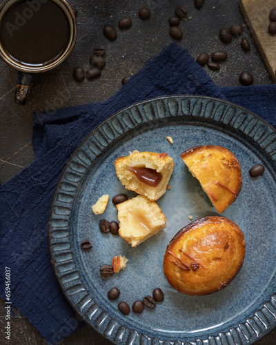 Pasticciotto leccese pastries on a plate near coffe cup and moka on dark table top view photo