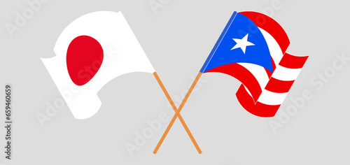 Crossed and waving flags of Japan and Puerto Rico