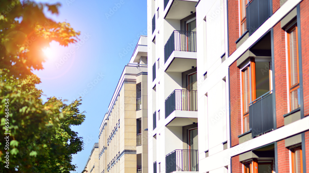 Brand new apartment building on sunny day. Modern residential architecture. Modern multi-family apartment house. Brand new apartment building on sunny day. Modern residential architecture. Modern multi-family apartment house.