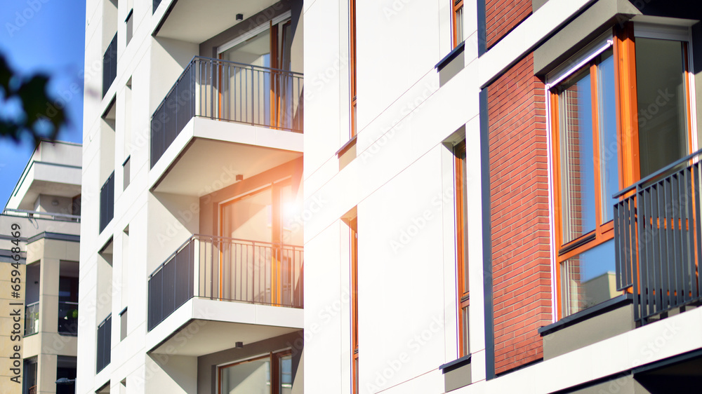 Brand new apartment building on sunny day. Modern residential architecture. Modern multi-family apartment house. Brand new apartment building on sunny day. Modern residential architecture. Modern multi-family apartment house.