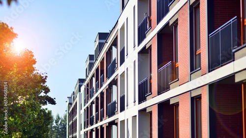Brand new apartment building on sunny day. Modern residential architecture. Modern multi-family apartment house. 