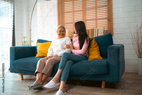 Enjoy happy smiling love multi-generation asian big hug family, Senior mature father and elderly mother with young adult daughter woman happy together at home, Health insurance concept, home care photo