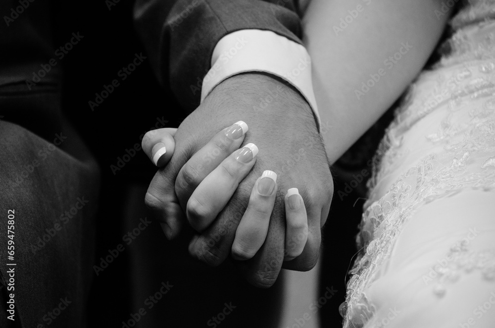 hands of the groom and bride
