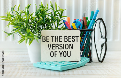 Word quotes of BE THE BEST VERSION OF YOU on colorful memo papers with wooden background.