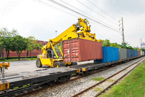 Reachstacker handling loading and unloand containers At rail transfer contaner station bangkok port photo